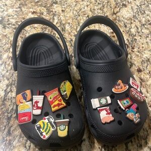 Used crocs black size j2 with pins